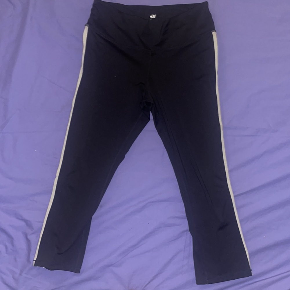 H & M SPORT LEGGINGS IN BLACK & SHINY SILVER STRIP GOING DOWN BOTH SIDE OF LEGS